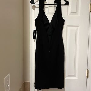 Black Lulus dress. Form fitting. Hits just above knee. Size XS